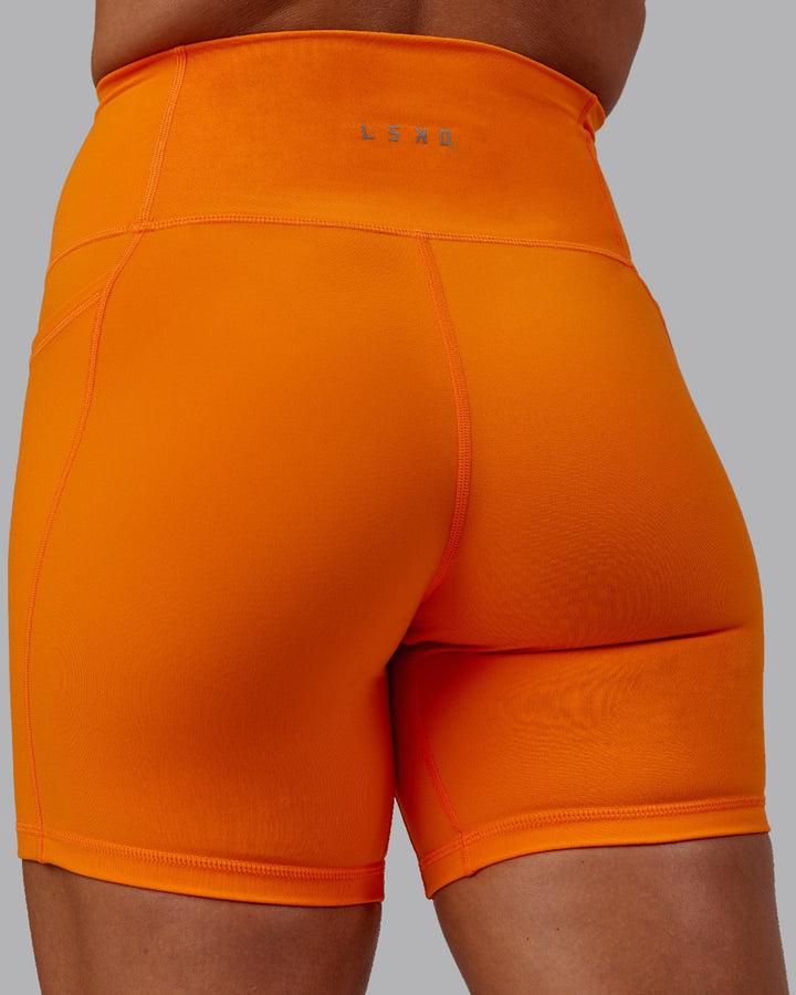 Woman wearing Fusion Mid-Length Shorts - Vibrant Orange
