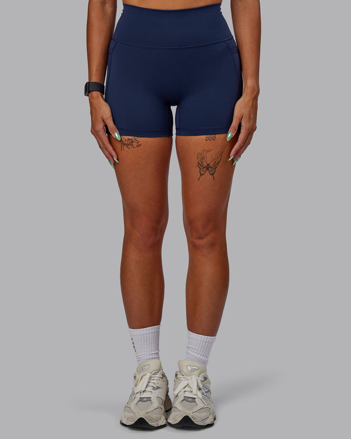 Woman wearing Fusion X-Short Tights with Pockets - Future Navy
