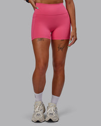 Woman wearing Fusion Ultra High-Rise 4" Short Pockets - Hot Pink | Set:true | Angle:front | Model:Vanessa | Size:S