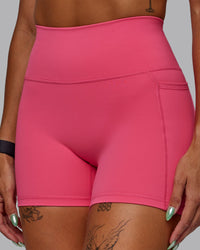 Woman wearing Fusion Ultra High-Rise 4" Short Pockets - Hot Pink | Model:Vanessa | Size:S