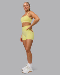 Woman wearing Fusion Ultra High-Rise 4" Short Pockets - Lemon Fizz | Model:Shalem | Size:S | Thumbnail Index: 3
