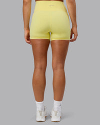 Woman wearing Fusion Ultra High-Rise 4" Short Pockets - Lemon Fizz | Model:Shalem | Size:S | Thumbnail Index: 2
