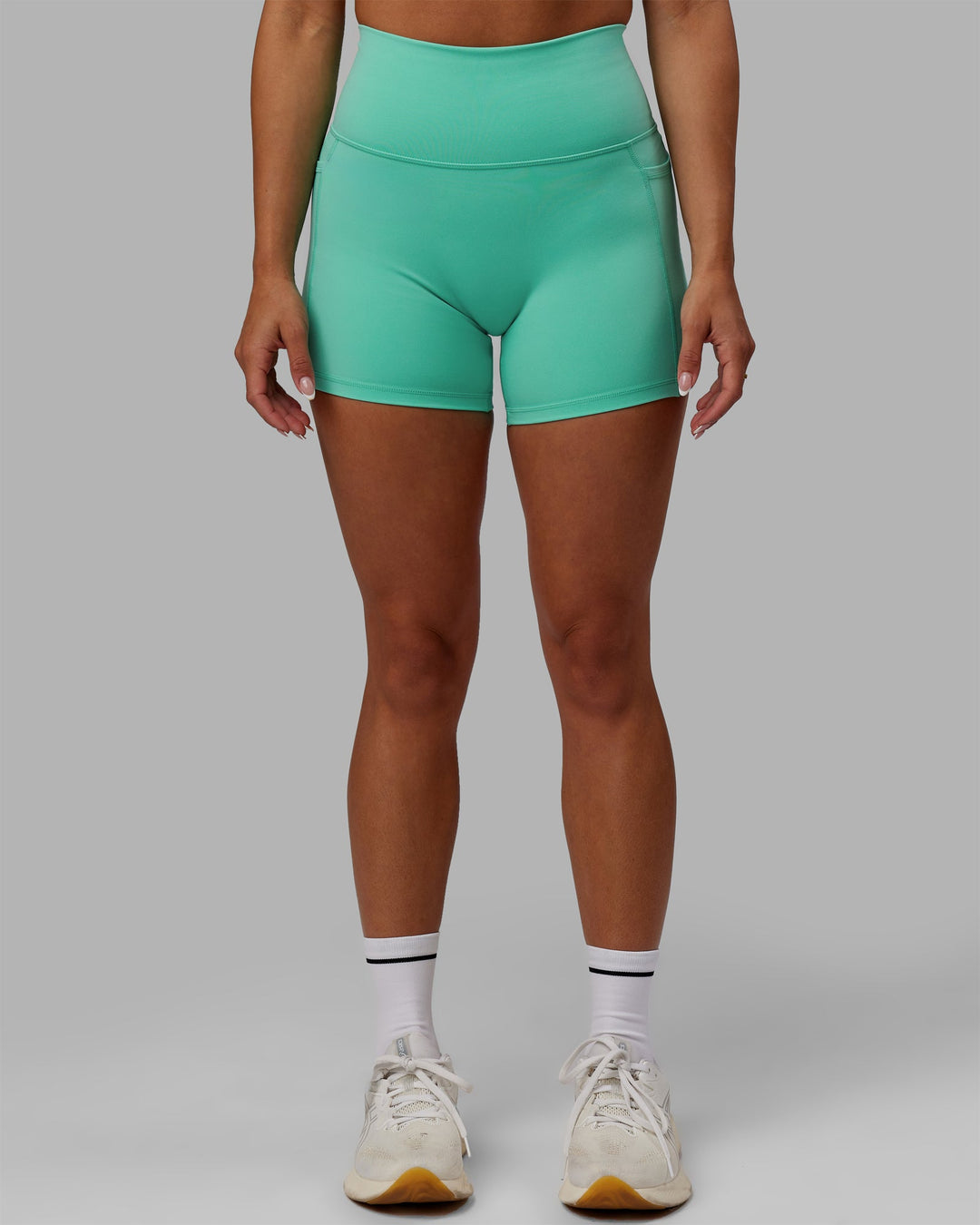 Woman wearing Fusion X-Length Shorts - Aquatic Awe