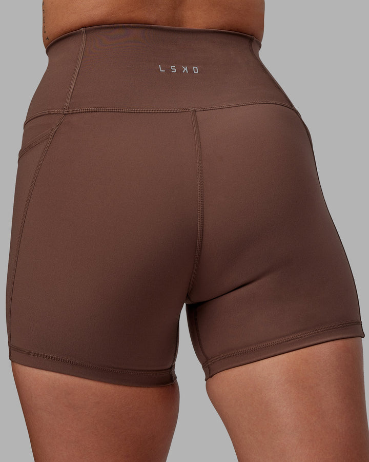 Woman wearing Fusion X-Length Shorts - Dull Rust
