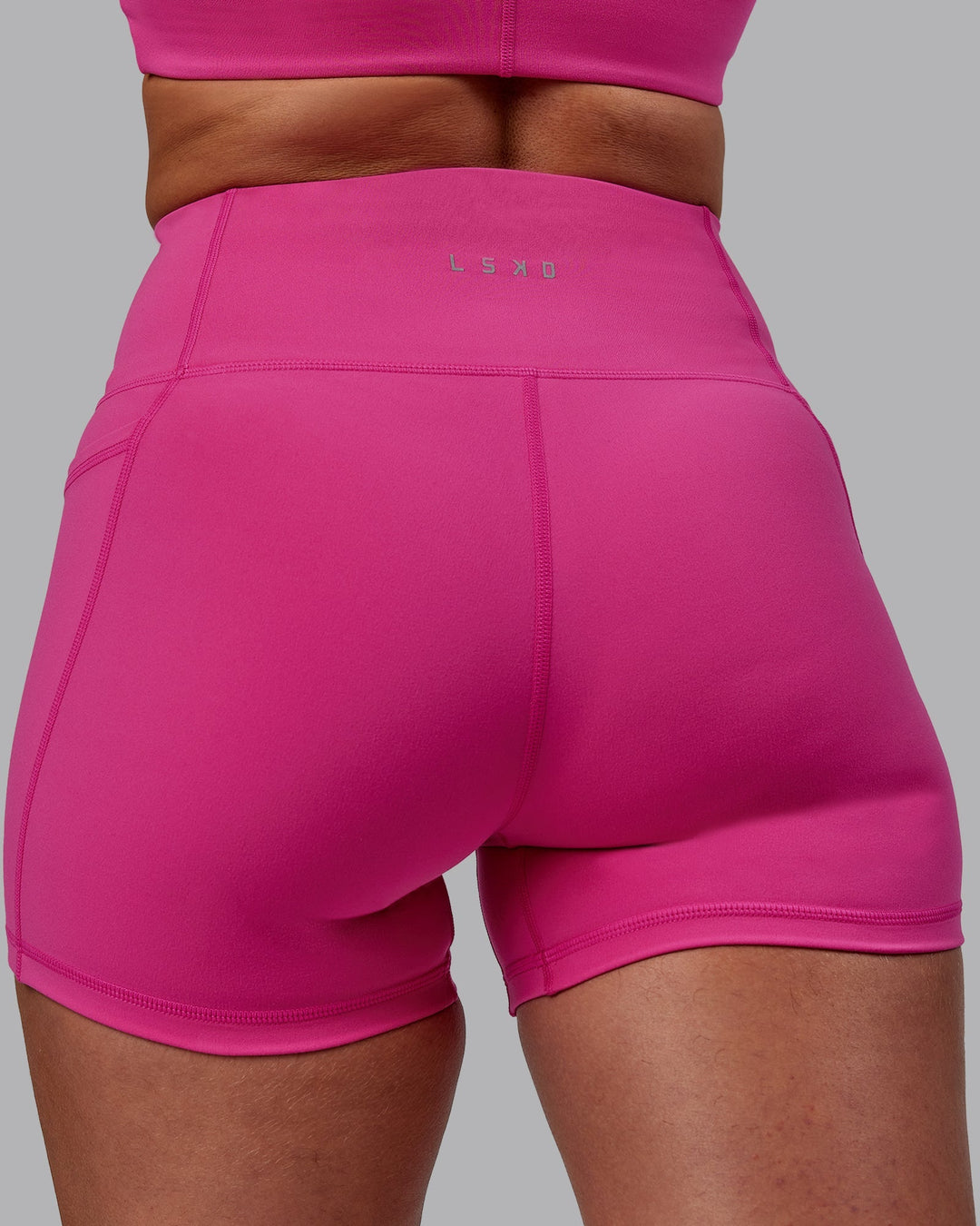 Woman wearing Fusion X-Length Shorts - Fuchsia Pink