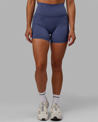 Woman wearing Fusion Ultra High-Rise 4" Short Pockets - Future Dusk | Model:Gabby | Size:S