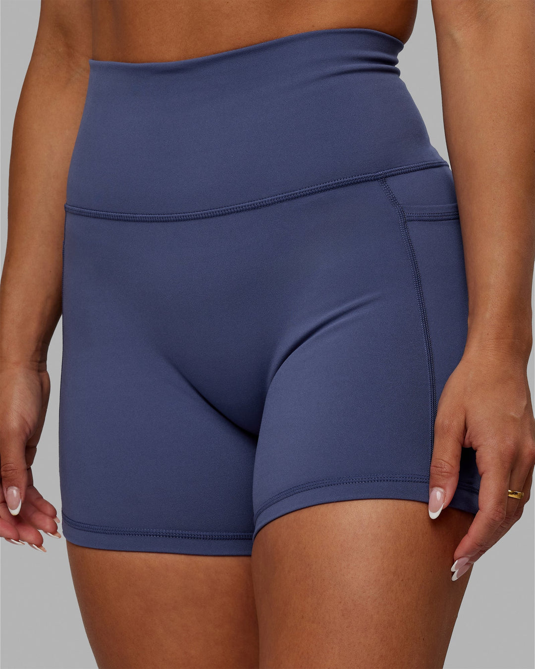 Woman wearing Fusion Ultra High-Rise 4" Short Pockets - Future Dusk | Model:Gabby | Size:S