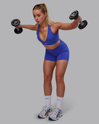 Woman wearing Fusion Ultra High-Rise 4" Short Pockets - Power Cobalt | Model:Hannah | Size:S