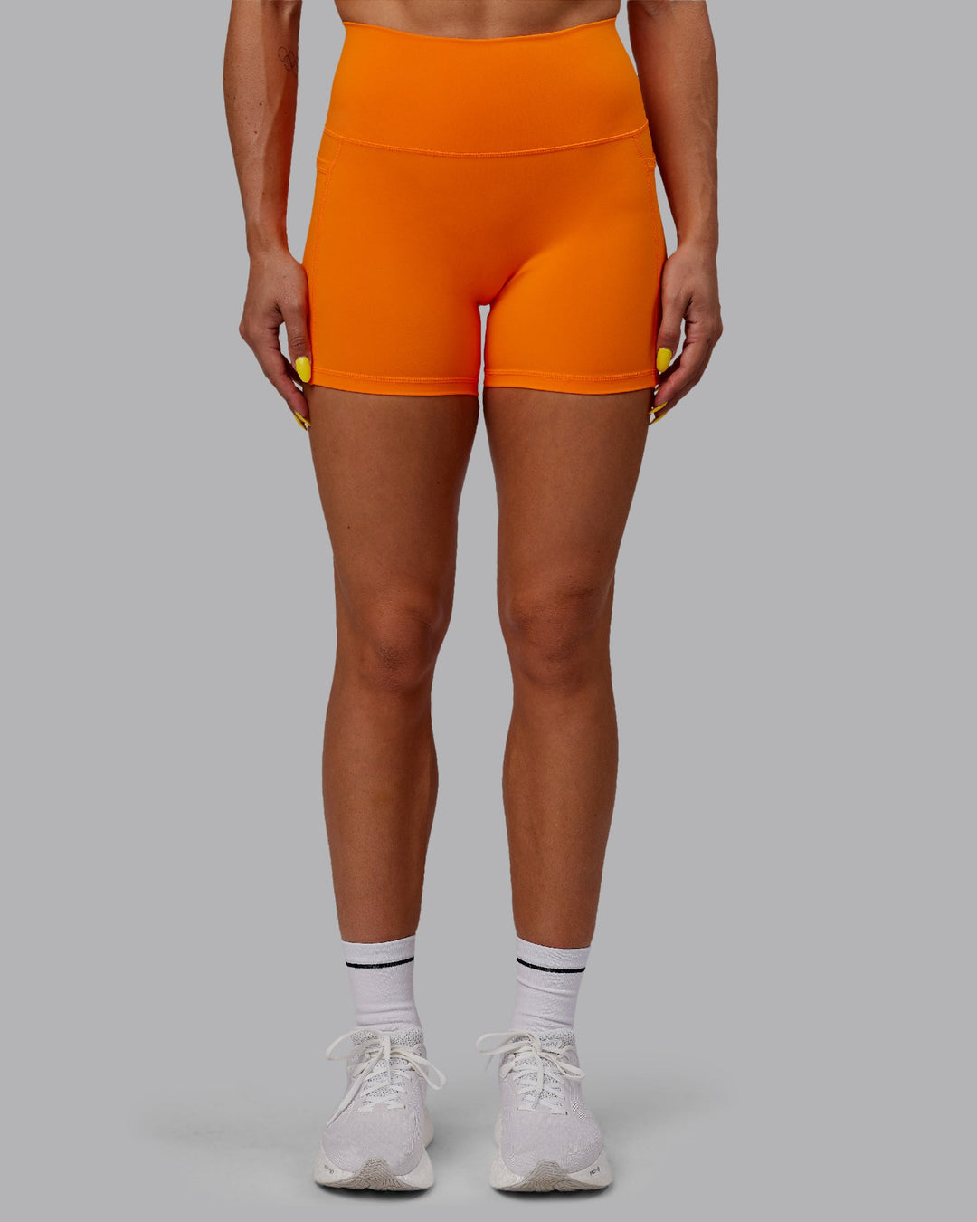 Woman wearing Fusion X-Length Shorts - Vibrant Orange