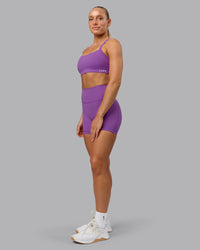 Woman wearing Fusion Ultra High-Rise 4" Short Pockets - Purple Fizz | Model:Shalem | Size:S