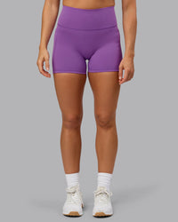 Woman wearing Fusion Ultra High-Rise 4" Short Pockets - Purple Fizz | Model:Shalem | Size:S