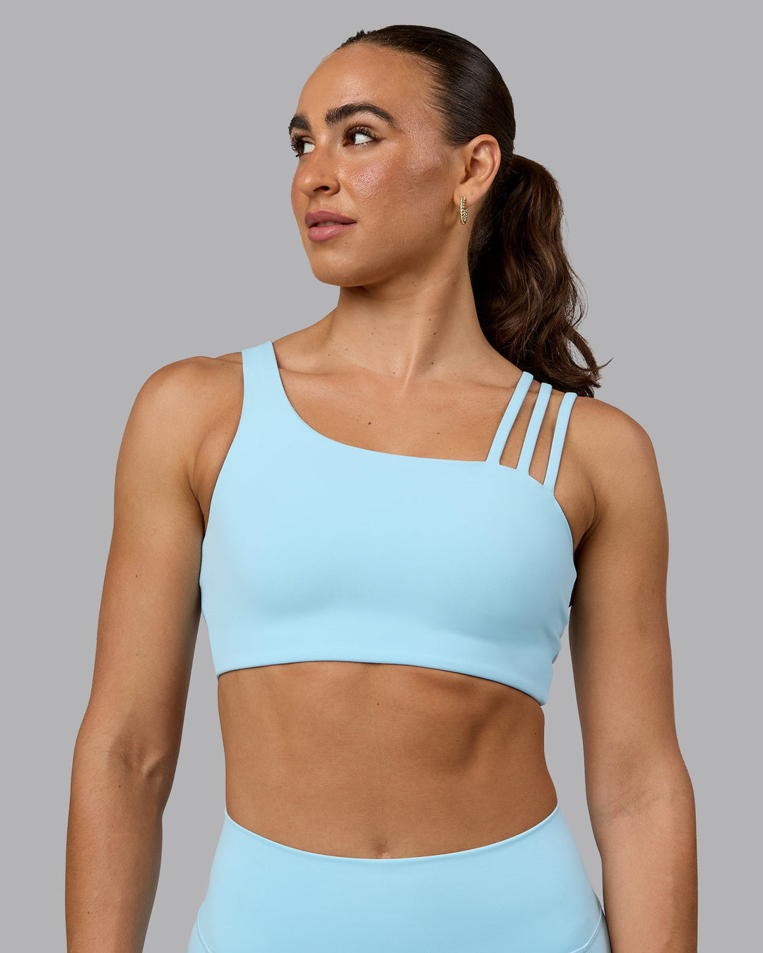 Woman wearing Galvanise Sports Bra - Crystal Blue