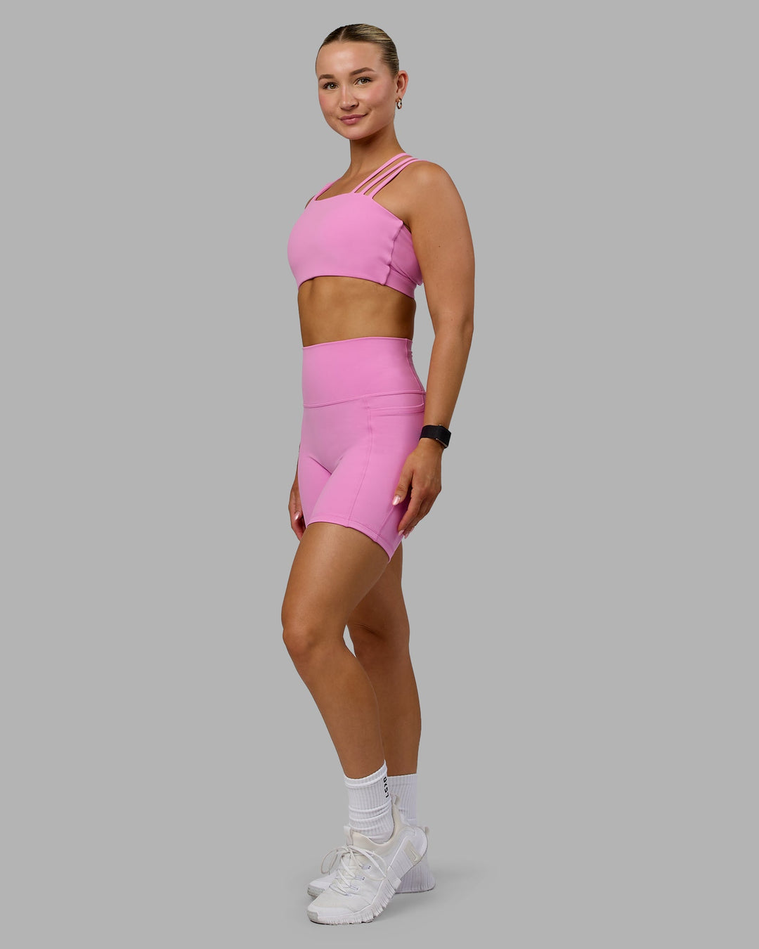 Woman wearing Galvanise Sports Bra - Spark Pink