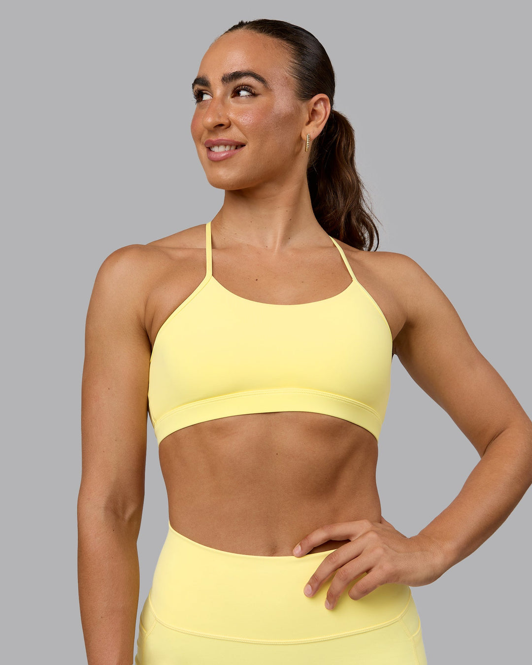 Woman wearing Glow Sports Bra - Lemon