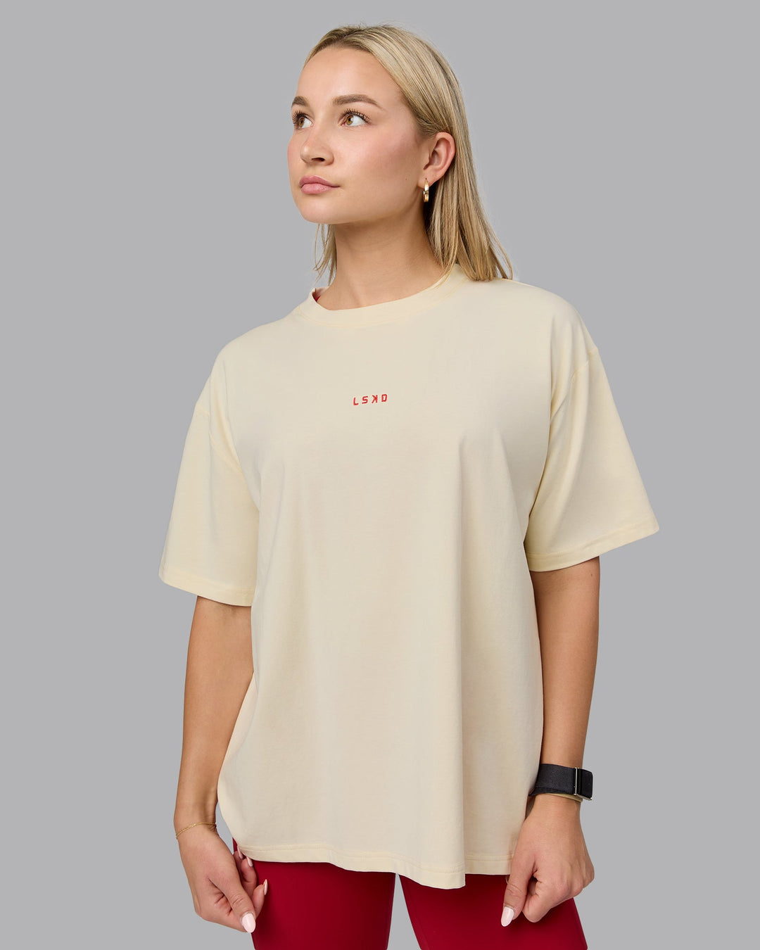 Woman wearing Go-To FLXCotton Oversized Tee - Ivory-Cherry Red