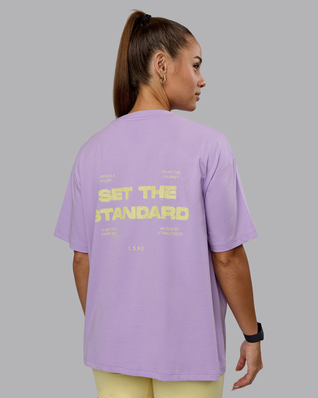 Woman wearing Go-To Set The Standard FLXCotton Oversized Tee - Pale Lilac-Elfin Yellow