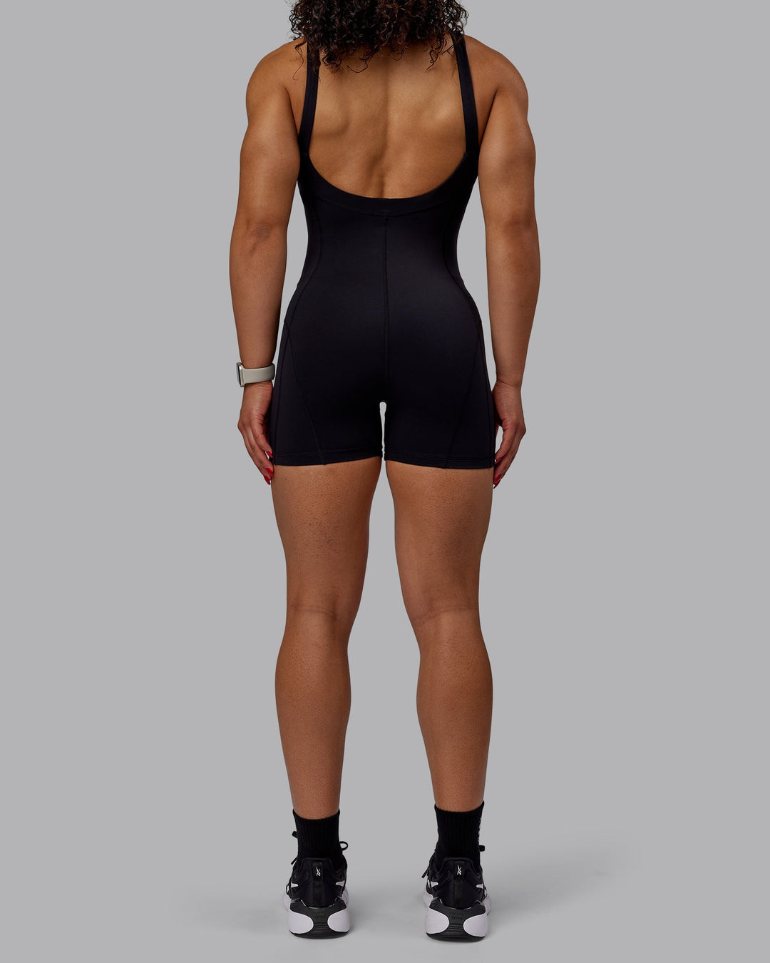 Woman wearing Inertia Bodysuit - Black