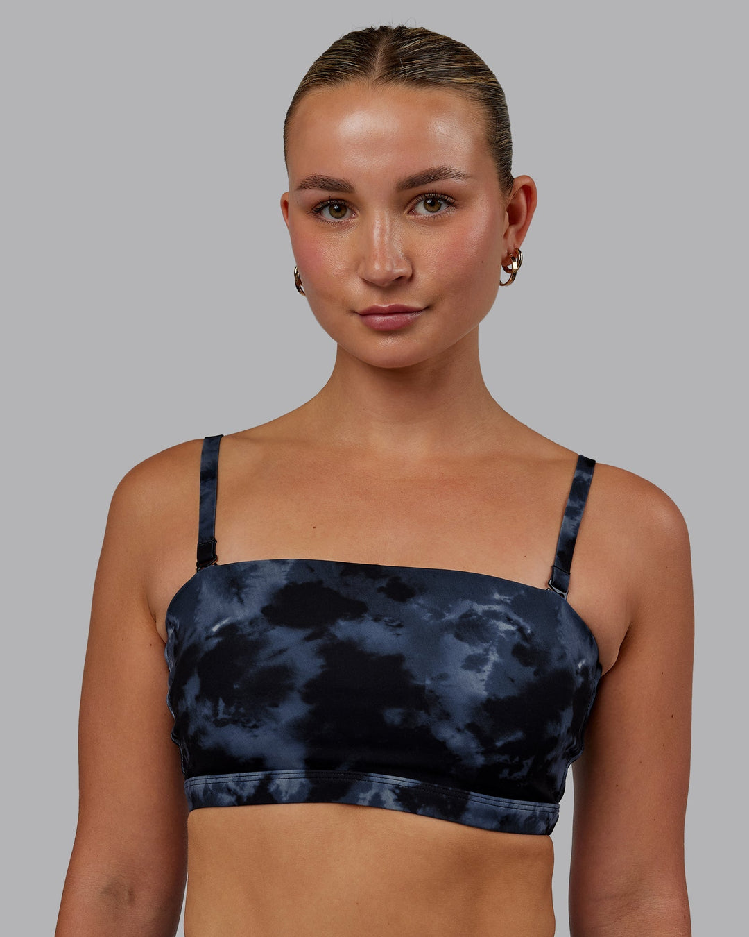 Woman wearing Inspire Sports Bra - Tie Dye-Midnight