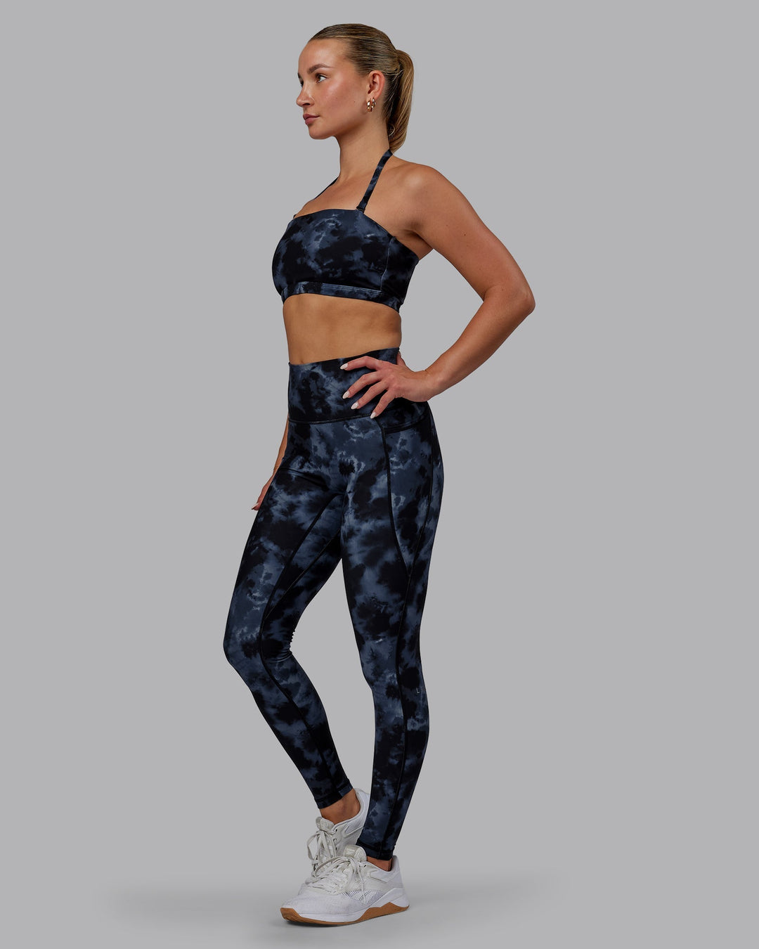 Woman wearing Inspire Sports Bra - Tie Dye-Midnight