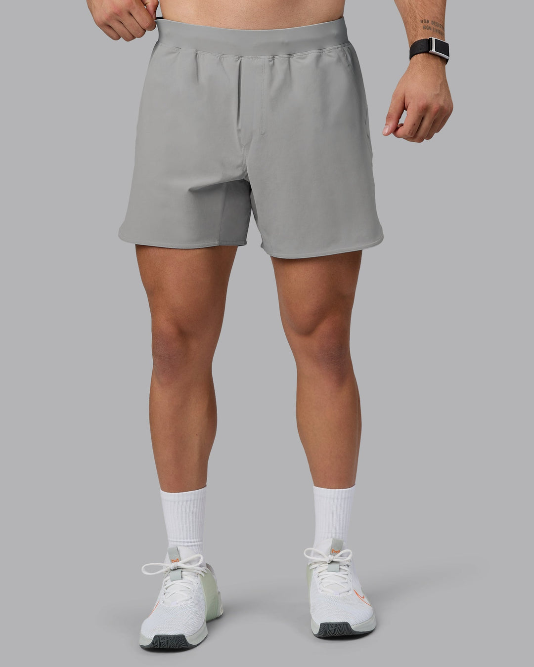 Man wearing Lift 6&quot; Lined Performance Shorts - Circular Grey