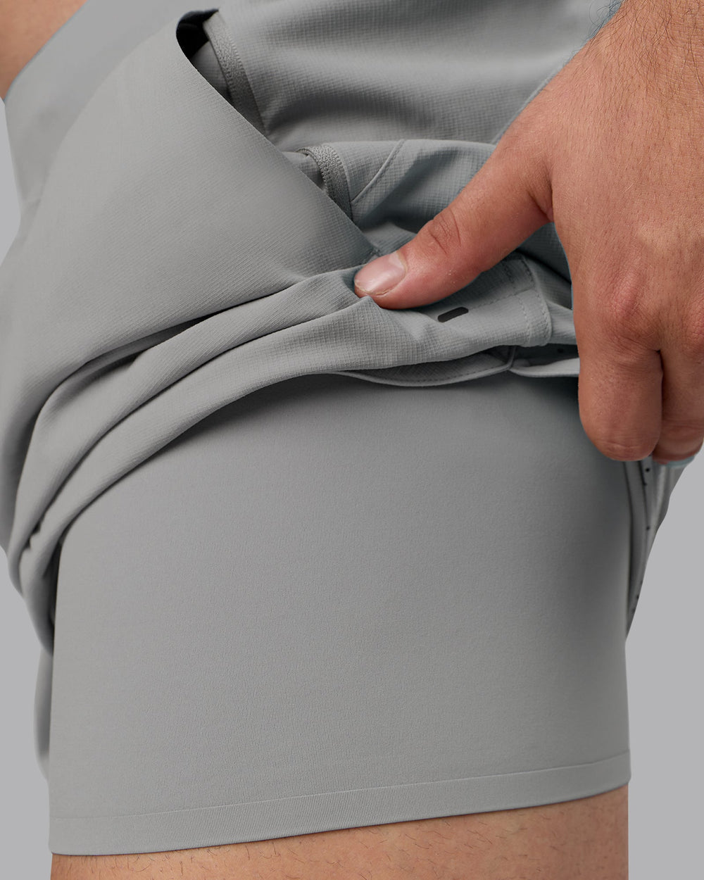 Man wearing Lift 6" Lined Performance Shorts - Circular Grey