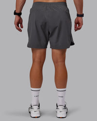 Man wearing Lift 6" Lined Performance Shorts - Dark Storm