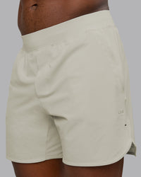 Man wearing Lift 6" Performance Short - Bone | Model:Sam | Size:L