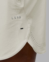 Man wearing Lift 6" Performance Short - Bone | Model:Sam | Size:L