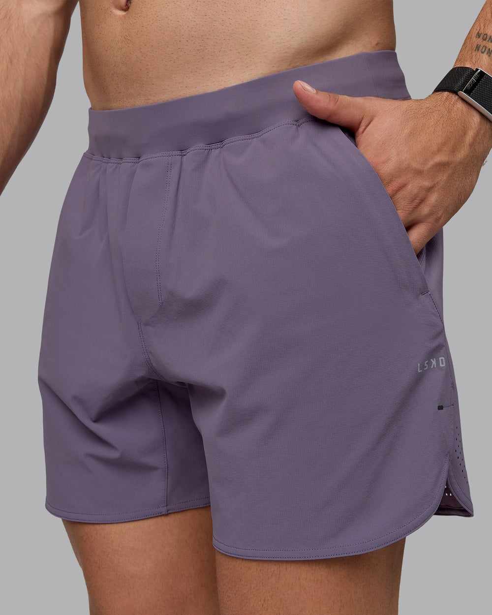 Man wearing Lift 6" Performance Shorts - Purple Sage