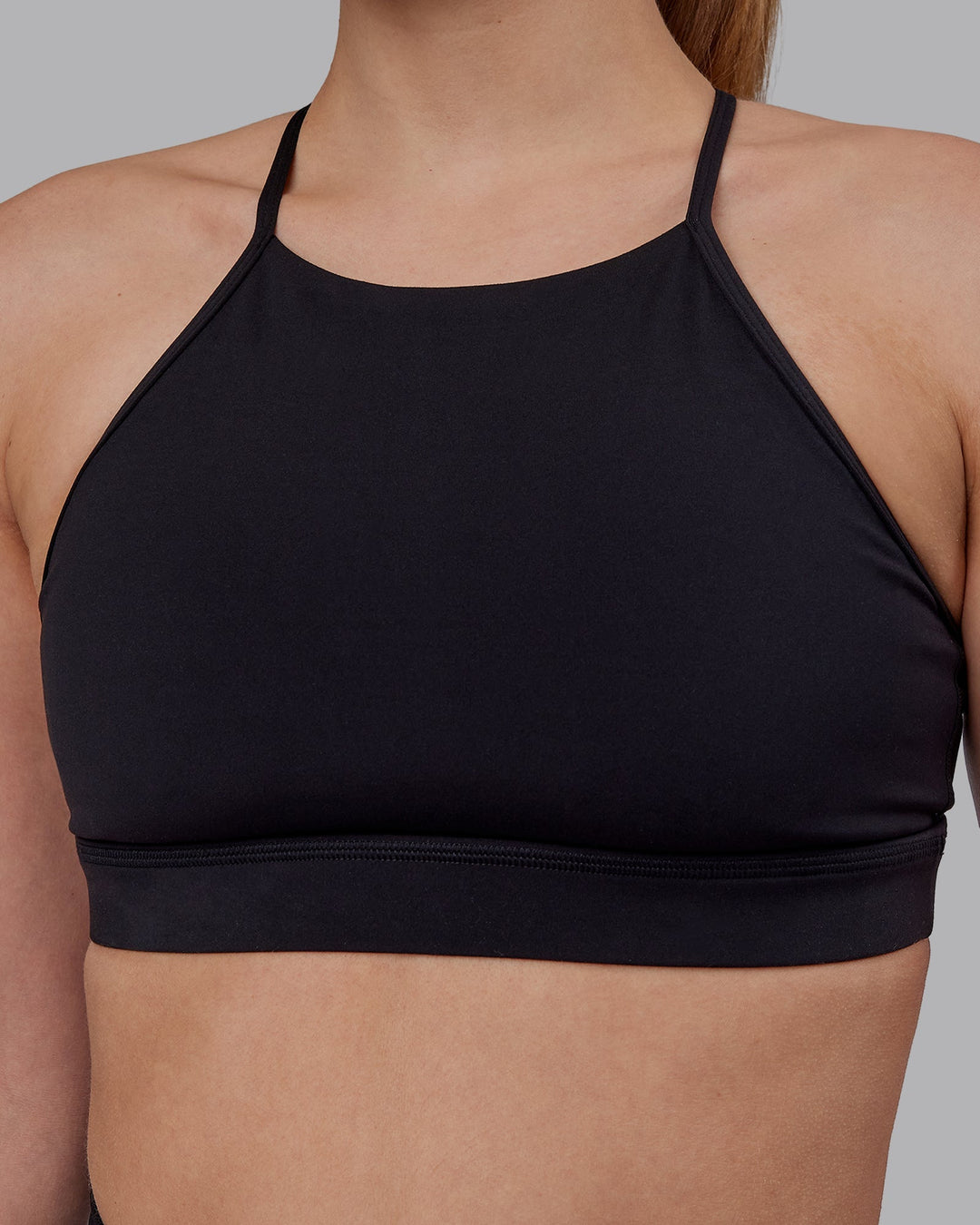 Woman wearing Lift High Neck Sports Bra - Black