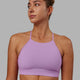 Woman wearing Lift High Neck Sports Bra - Light Violet