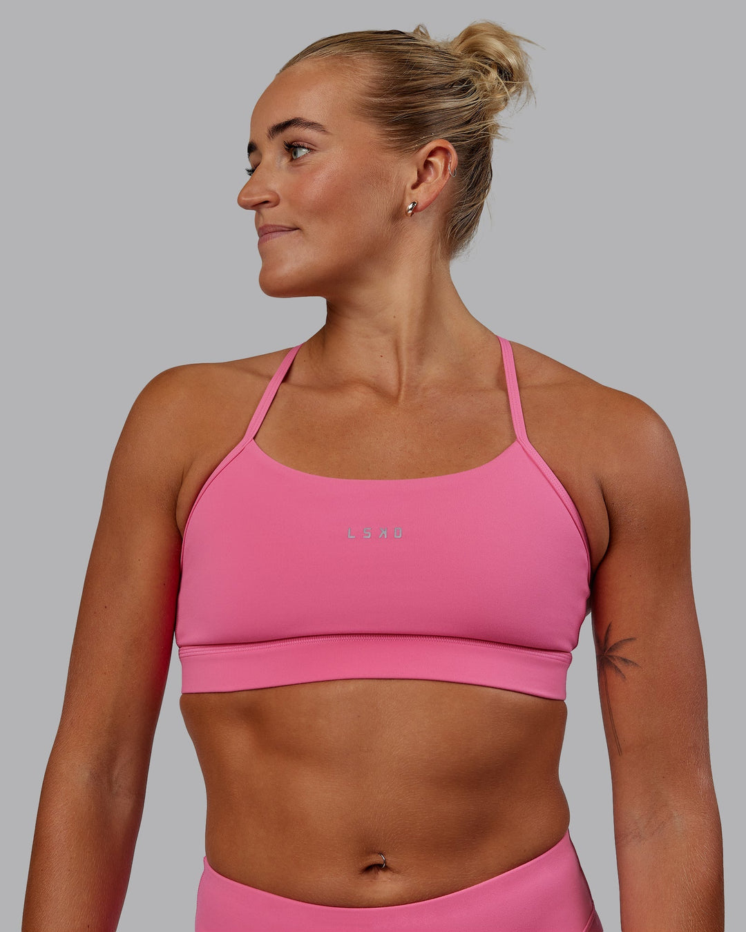 Woman wearing Lift Sports Bra - Carmine Rose