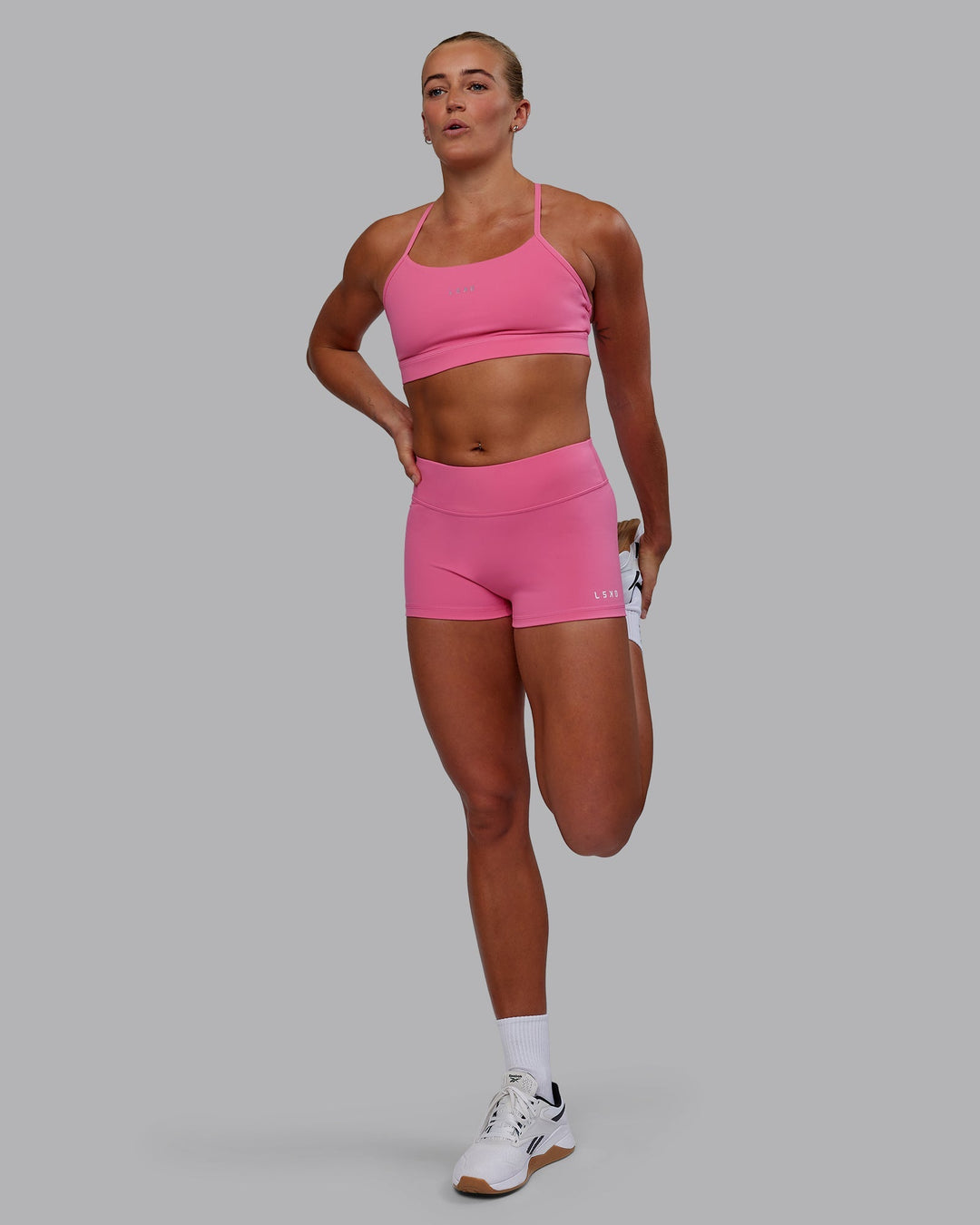 Woman wearing Lift Sports Bra - Carmine Rose