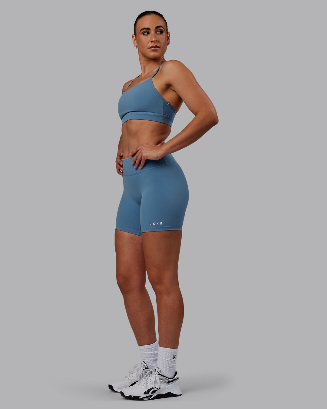 Woman wearing Lift Sports Bra - Elemental Blue