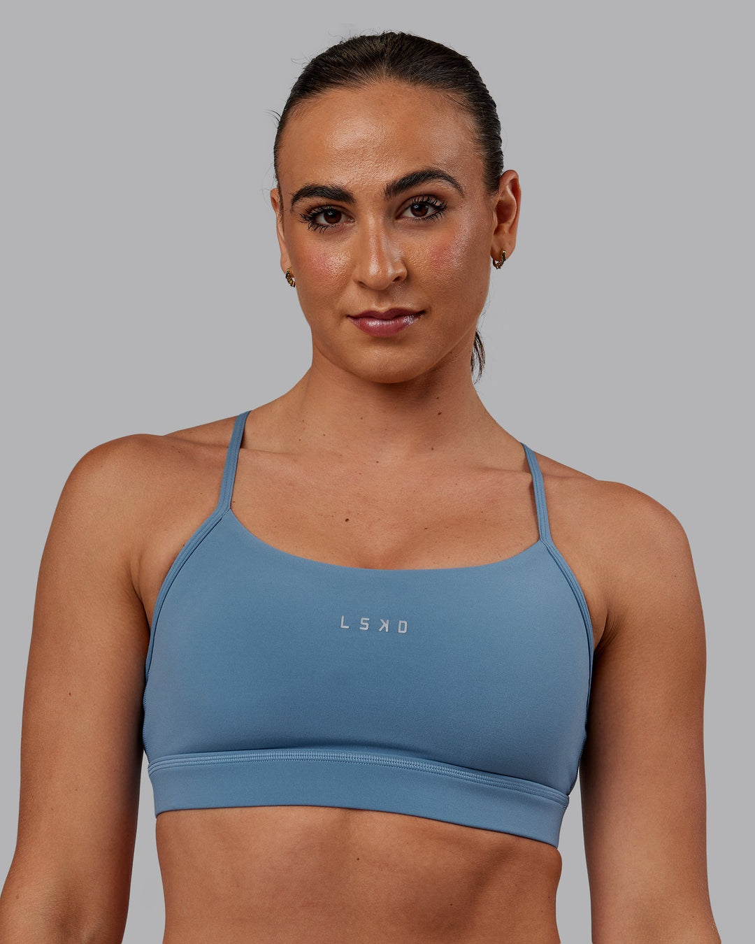 Woman wearing Lift Sports Bra - Elemental Blue