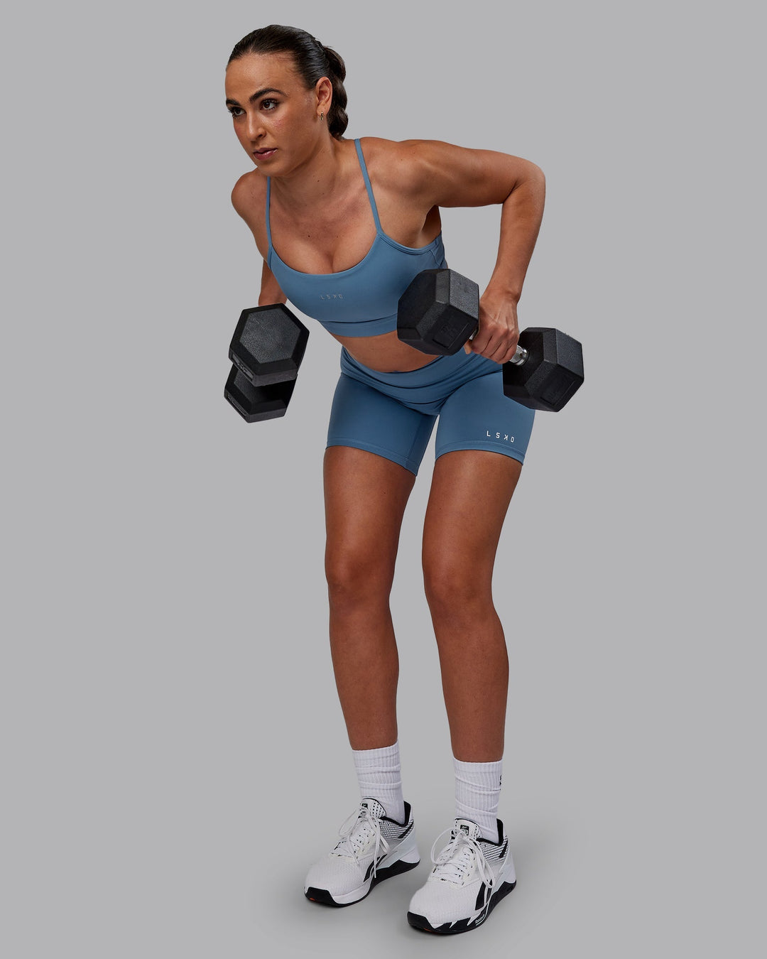 Woman wearing Lift Sports Bra - Elemental Blue