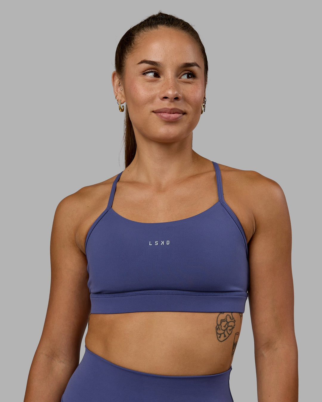 Woman wearing Lift Sports Bra - Future Dusk