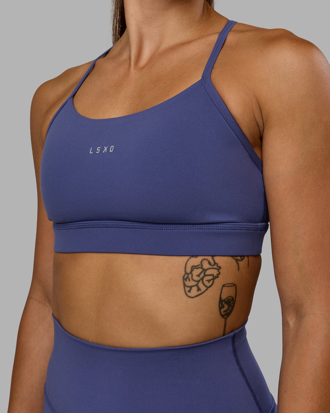 Woman wearing Lift Sports Bra - Future Dusk