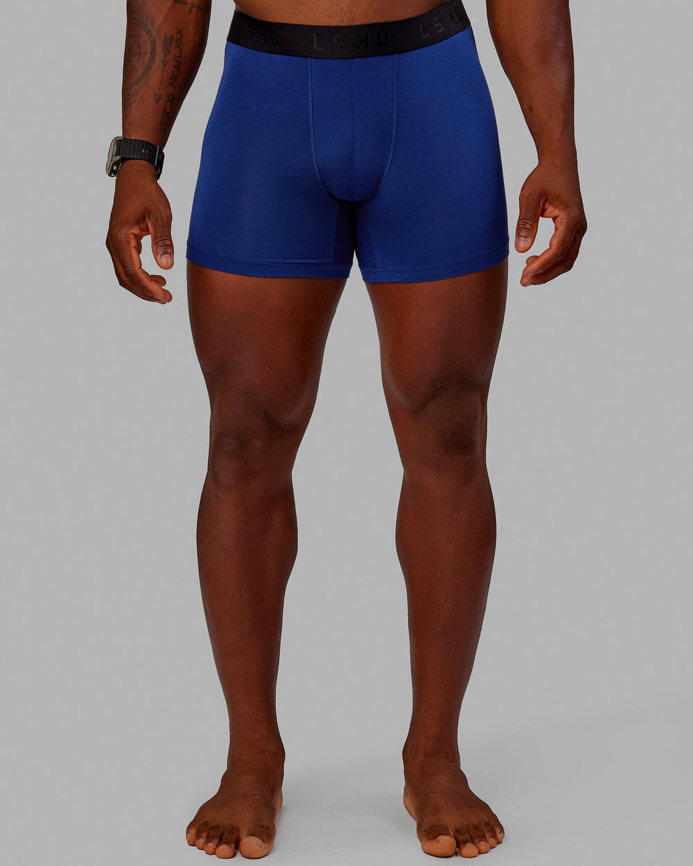 Man wearing MVP Trunks 3 Pack - Black/Cilantro/Midnight Blue