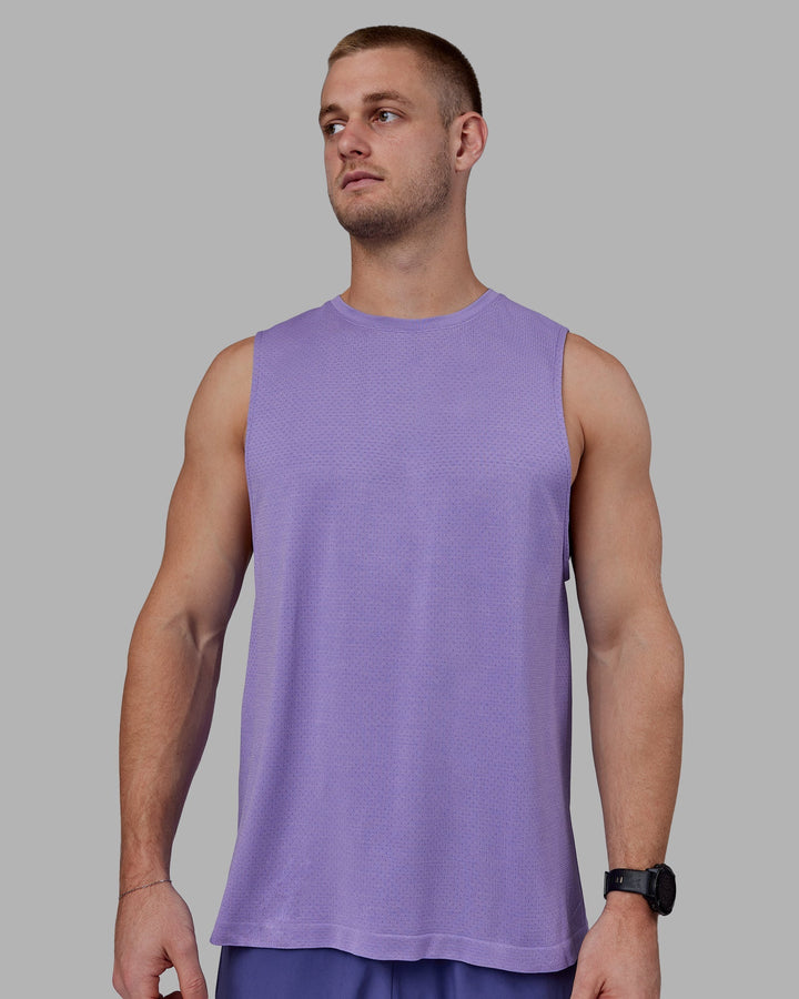 Man wearing AeroFLX+ Seamless Muscle Tank - Dahlia Purple Marl
