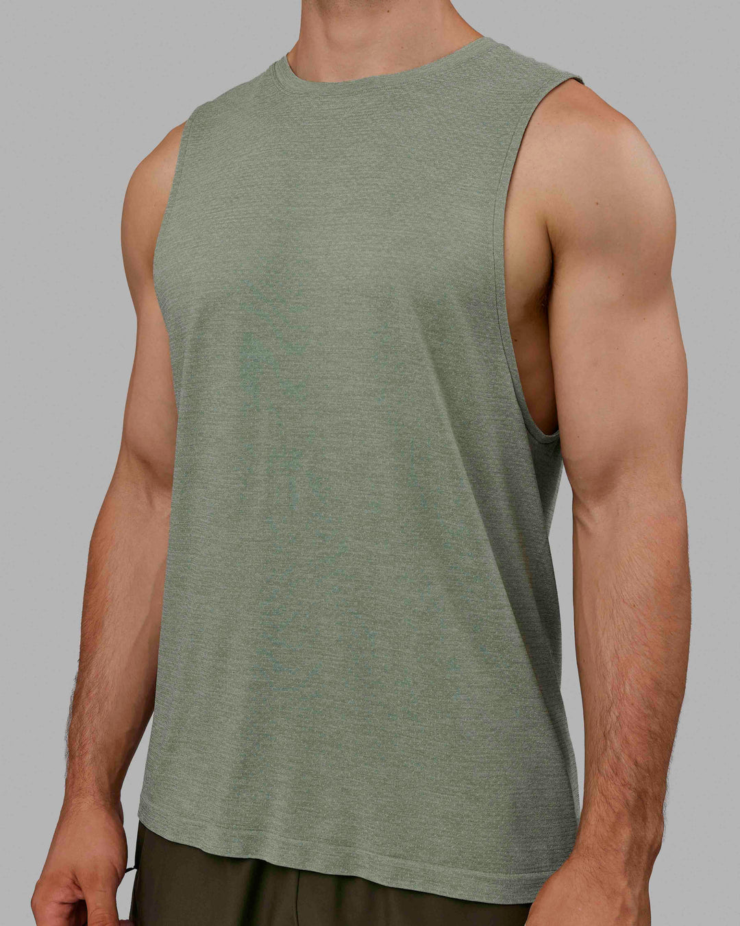 Man wearing AeroFLX+ Seamless Muscle Tank - Iceberg Green Marl