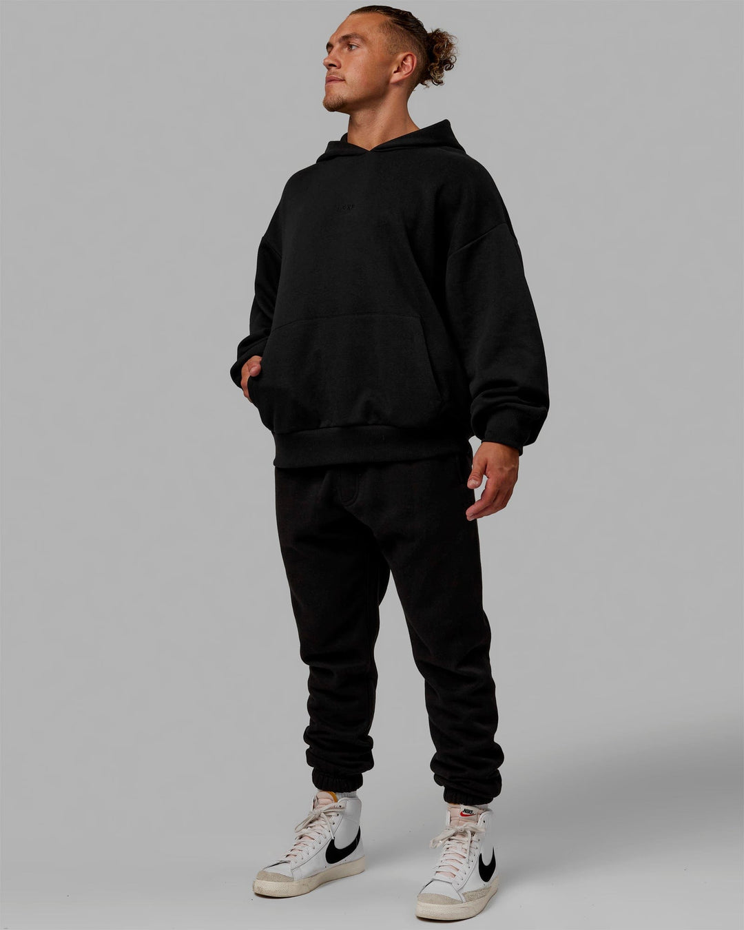 Man wearing MVP Track Pants - Black