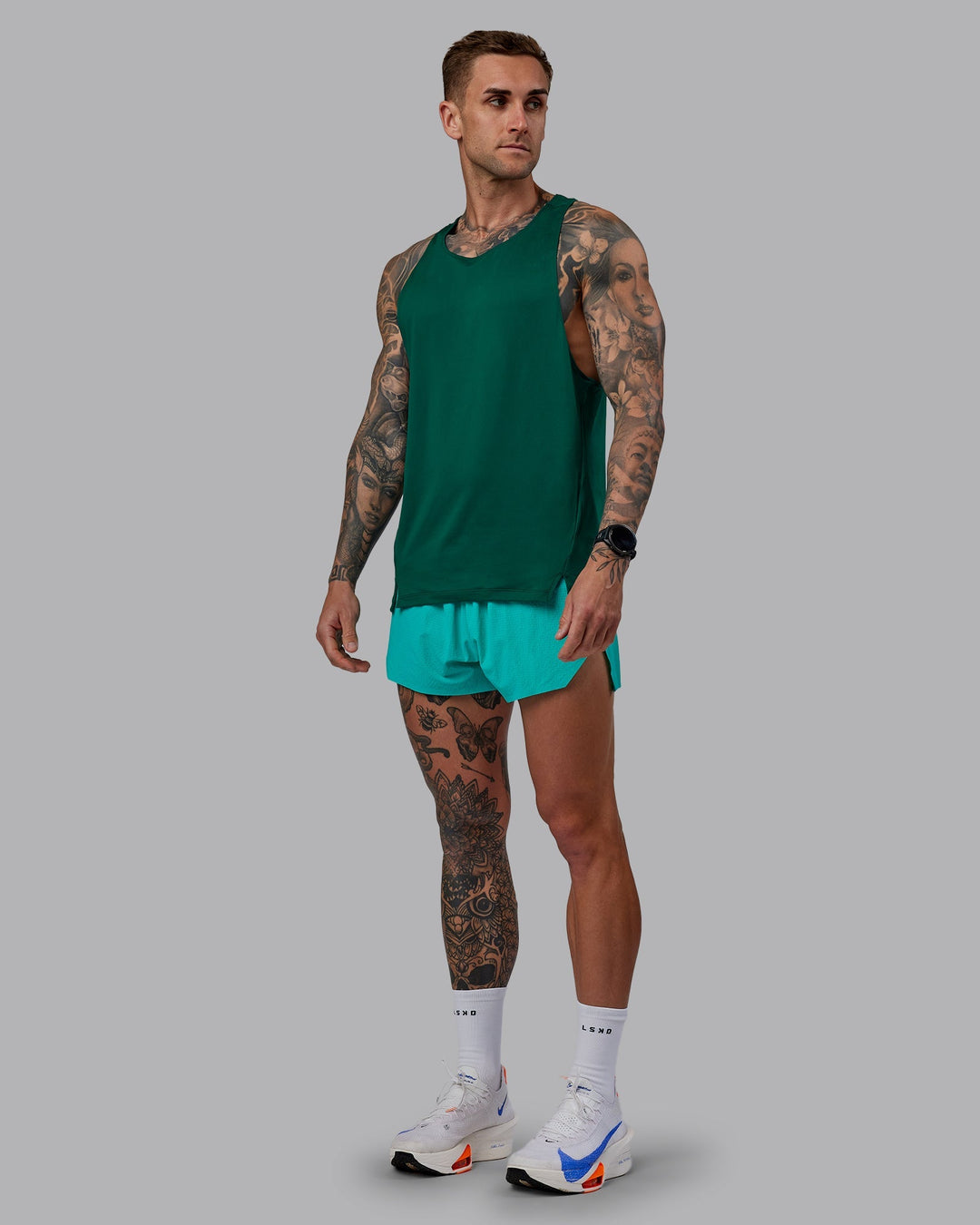 Man wearing Pace Running Tank - Malachite