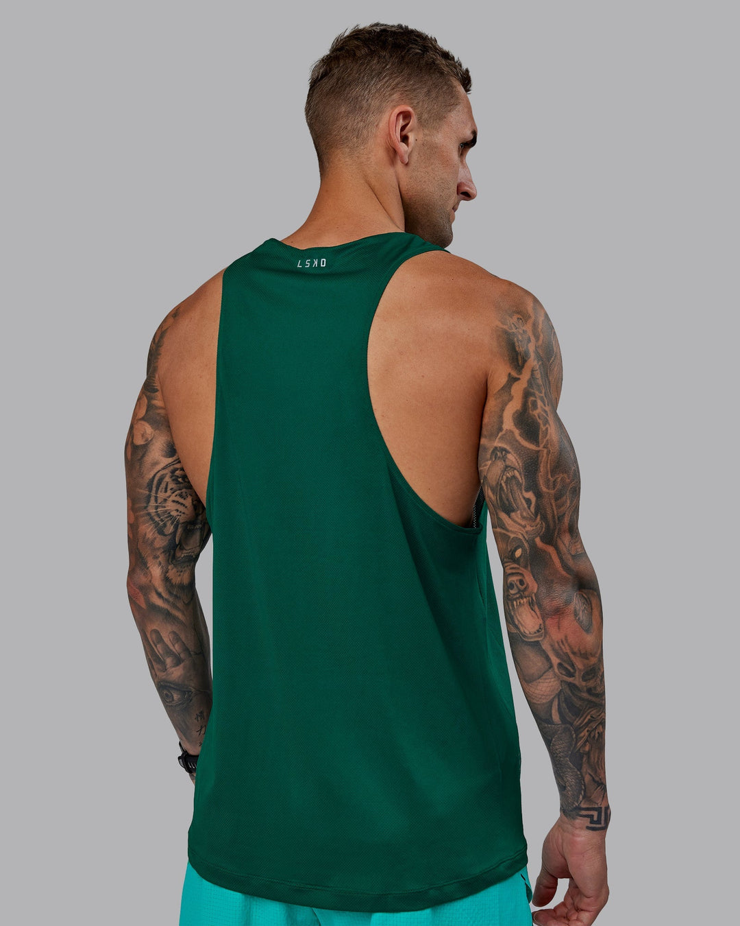 Man wearing Pace Running Tank - Malachite