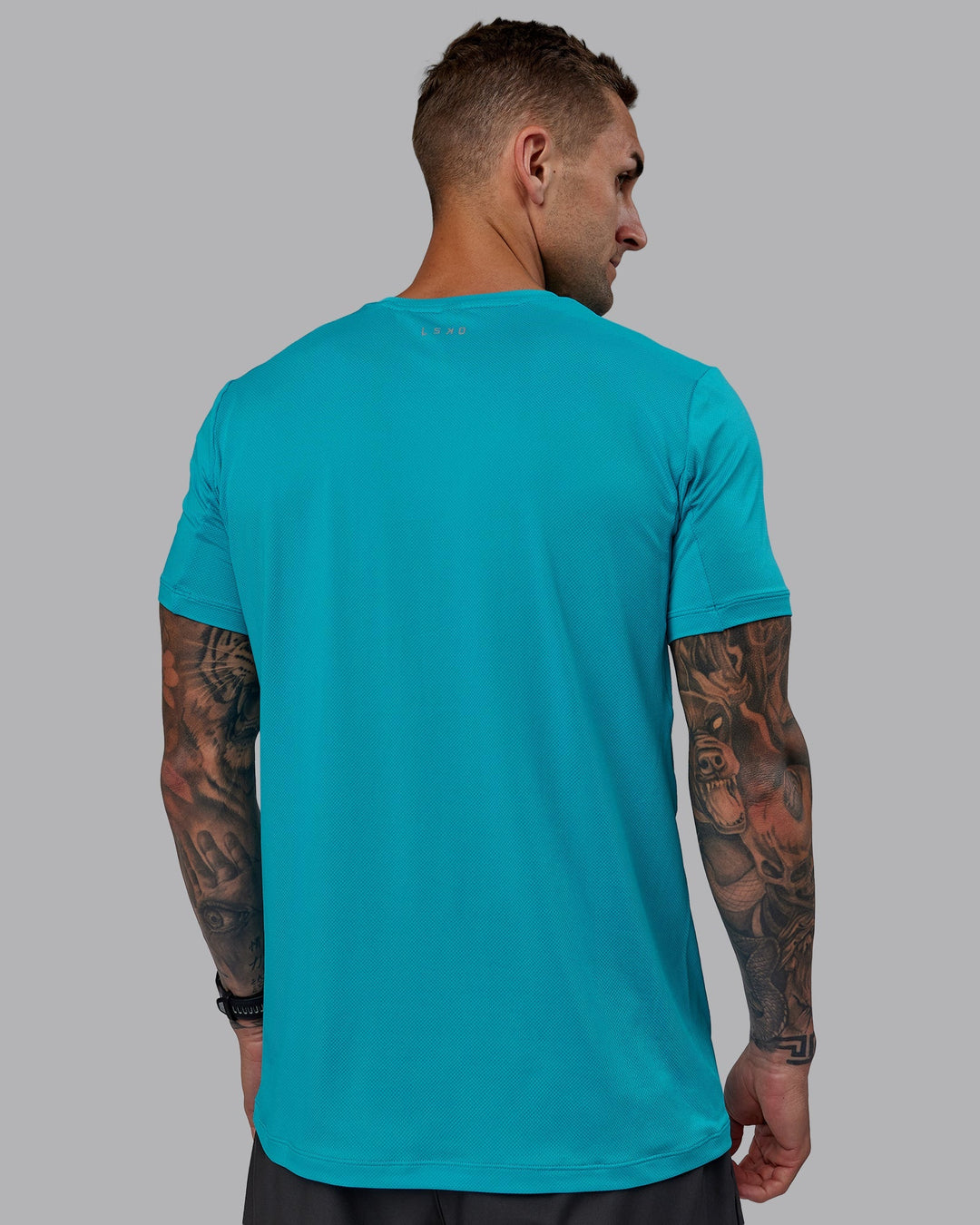 Man wearing Pace Running Tee - Blue Bird