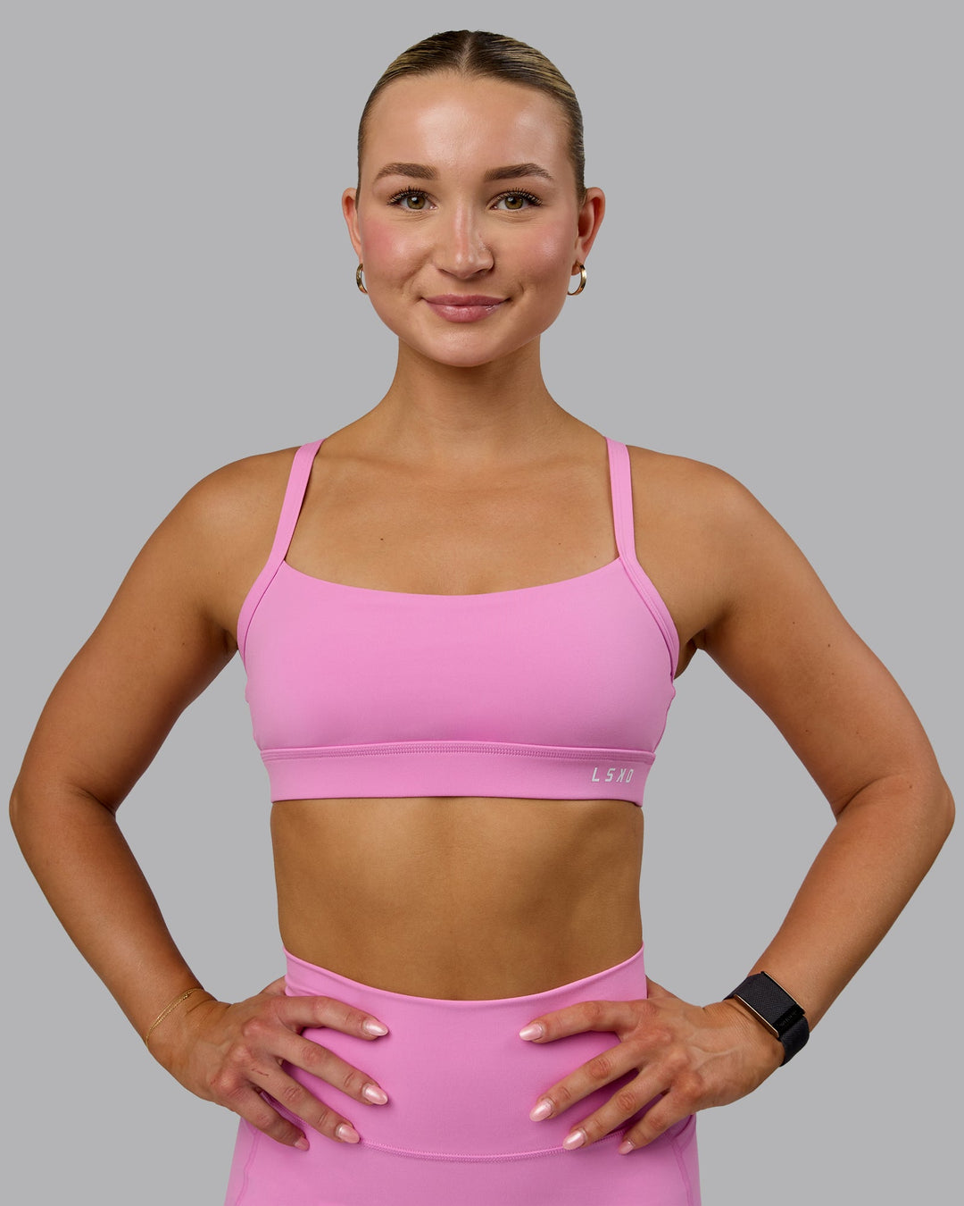 Woman wearing Momentum Sports Bra - Spark Pink