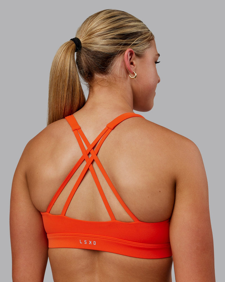 Woman wearing Nirvana Sports Bra - Grenadine
