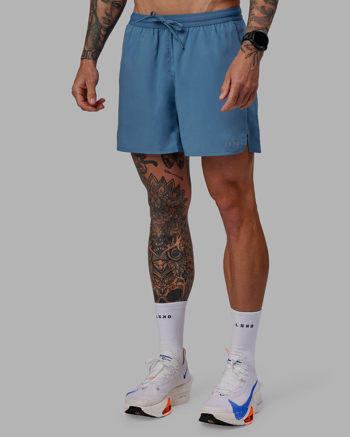 Man wearing Pace 5&quot; Lined Performance Shorts - Elemental Blue
