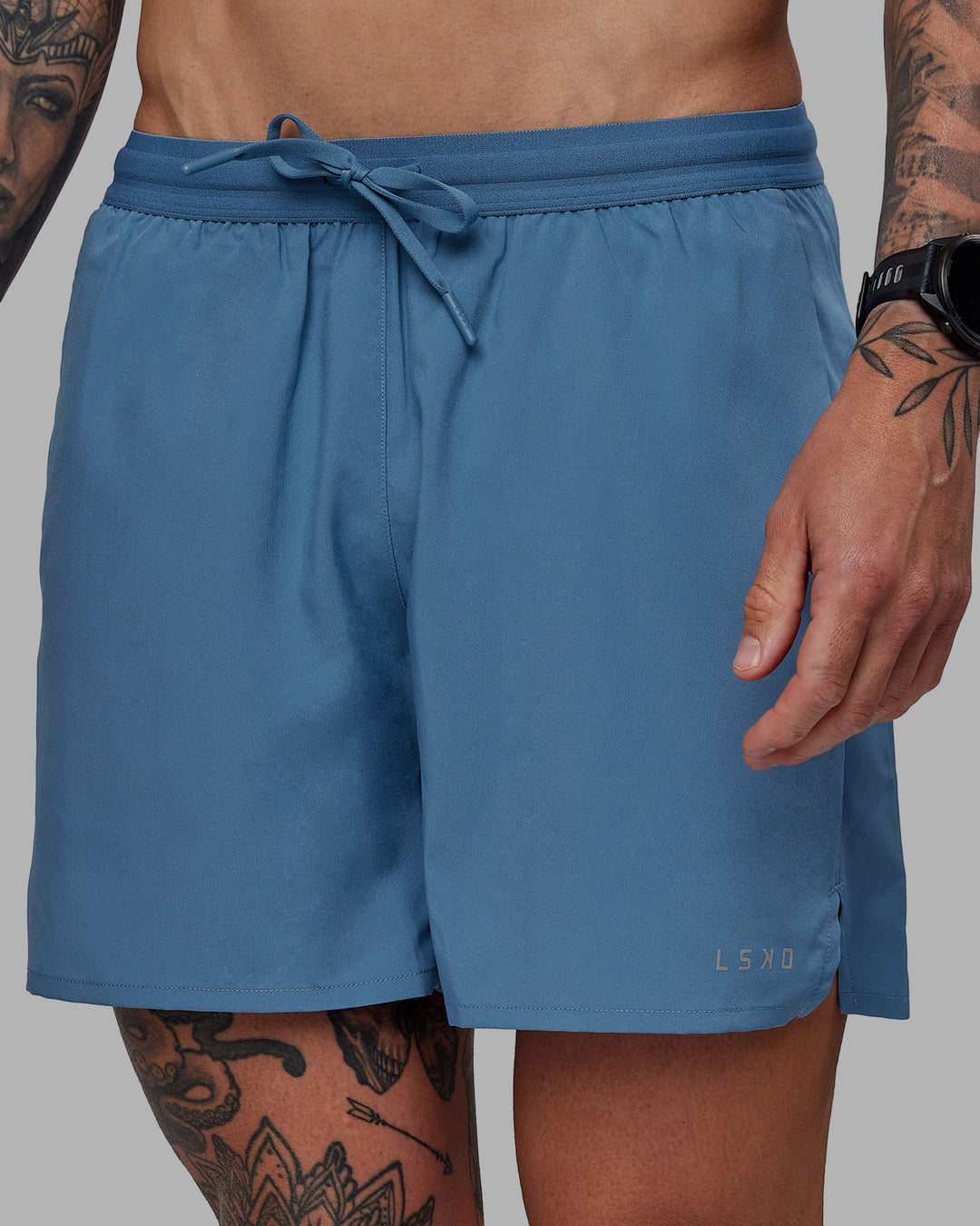 Man wearing Pace 5&quot; Lined Performance Shorts - Elemental Blue