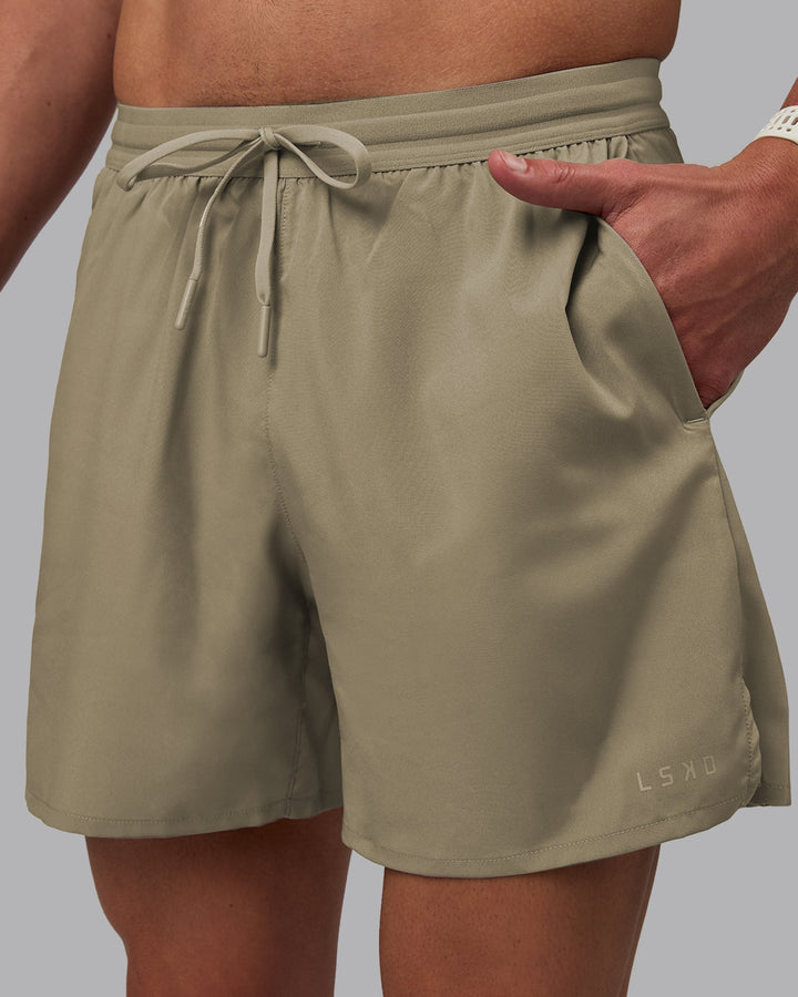 Man wearing Pace 5&quot; Lined Performance Shorts - Elephant
